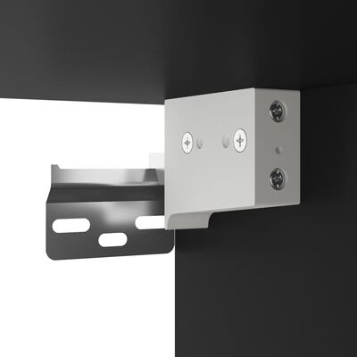 Close-up of metal hinge and mounting plate attaching shelf to cabinet.