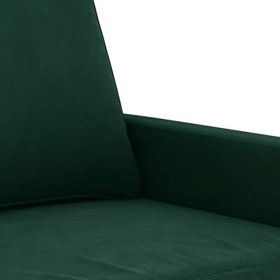 Close-up of a dark green sofa armrest and seat fabric with visible stitching.