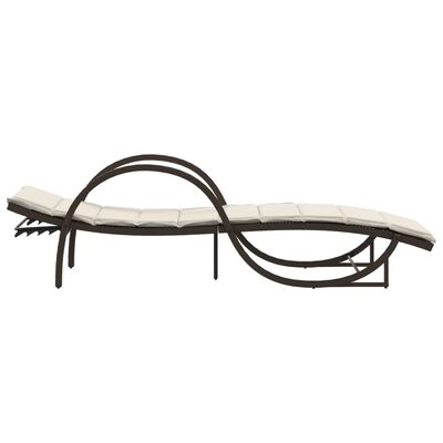 Side profile of an outdoor chaise lounge with curved metal frame and beige cushion.