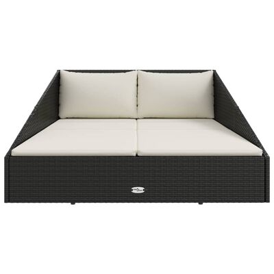 Front view of a dark brown wicker outdoor daybed with beige cushions