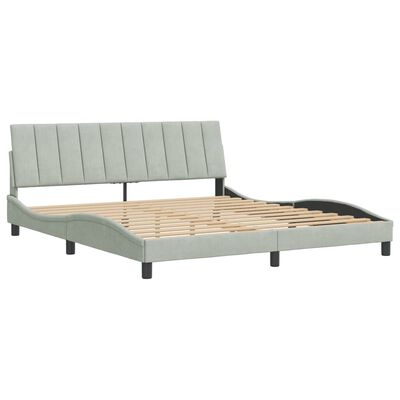 Platform bed frame with slatted wooden support and exposed side rails in light gray upholstery.