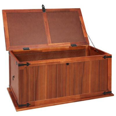 Open wood storage chest showing interior compartments and chain lid support.