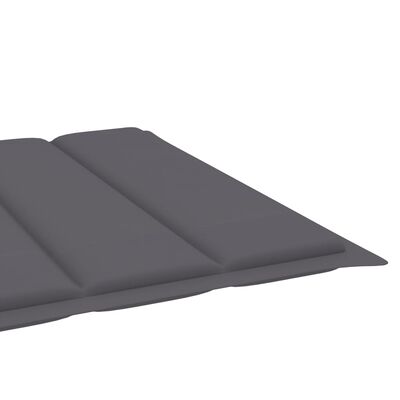 Close-up of thick grey cushions with raised sections on a lounge pad.