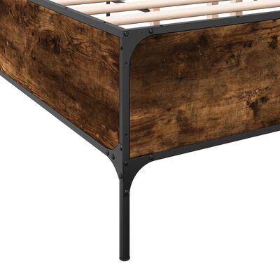Close-up of dark wood paneling and metal corner bracket on bed frame