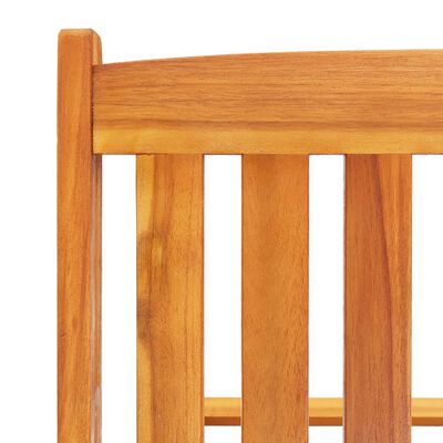 Top corner of wooden lounge chair showing vertical slats