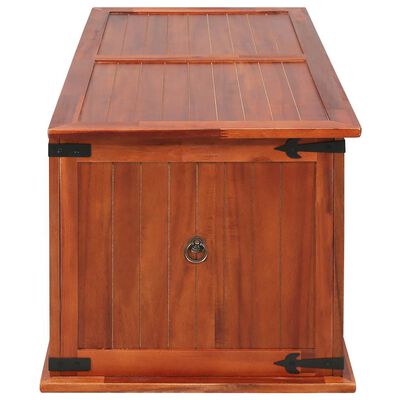 Wood storage chest captured from top and side, lid closed revealing panel design.