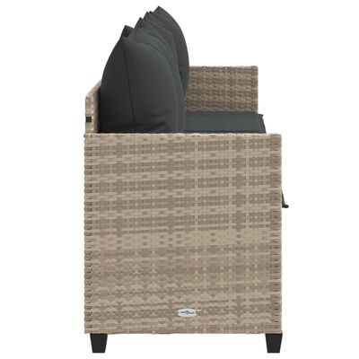 Side view of a woven outdoor sofa showing armrest and dark gray cushions.