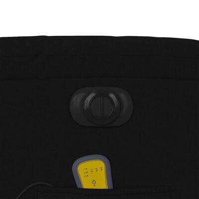 Close-up of chair control dial or knob and pocket with yellow tag