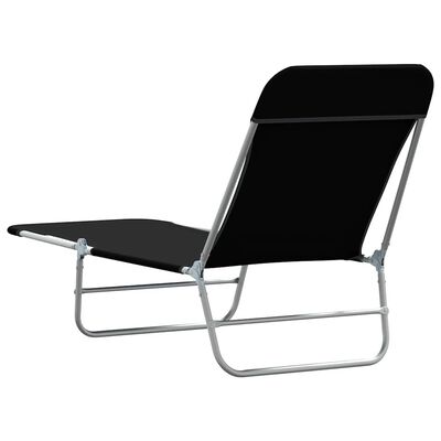 Black cushioned lounge chair with chrome frame, viewed from side.