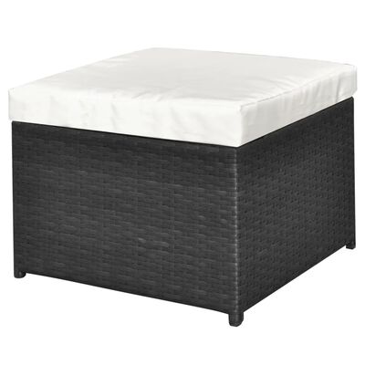 Square ottoman with white cushion on top, dark wicker base.