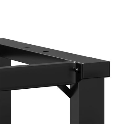 Close-up of the end of the desk frame showing a joint and top rail.
