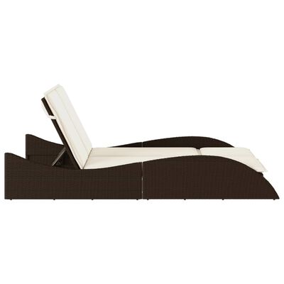 Side profile of a brown wicker outdoor daybed with a tilt-back backrest