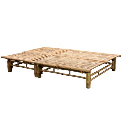 A wider bamboo lounge bed flat on a platform.