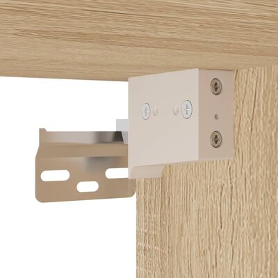 Close-up of metal hinge bracket mounted to cabinet