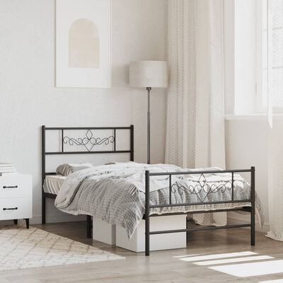 Twin/Single black metal bed frame with decorative wrought-iron style headboard and footboard; mattress and bedding visible; room interior setup