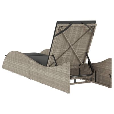 Open underside of a rattan chaise lounge showing its frame and mechanical support.