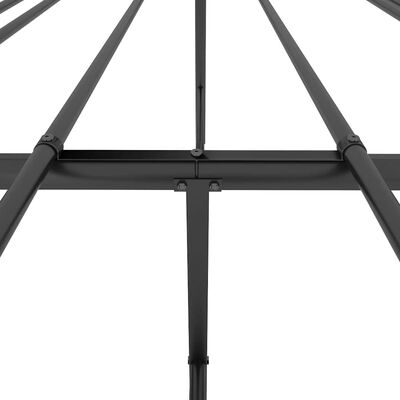 Close-up of joints and tube connections on metal bed frame.