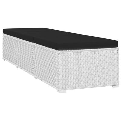 Long white wicker outdoor storage ottoman with black cushion cover
