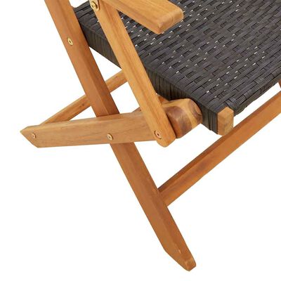 Close-up of the folding mechanism showing wooden frame joints of the chair.