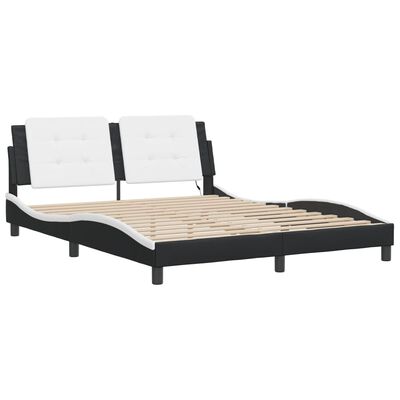 Bed frame with white padded headboard and black frame
