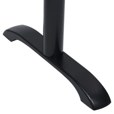 Curved foot base of black table leg.