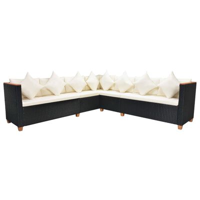 Black wicker outdoor sectional with beige cushions forming a long run, with multiple seats.