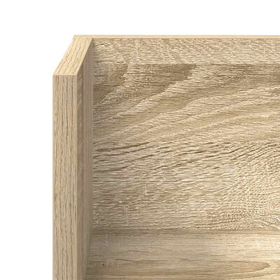Close-up of interior corner of wooden shelf showing wood grain and joint.