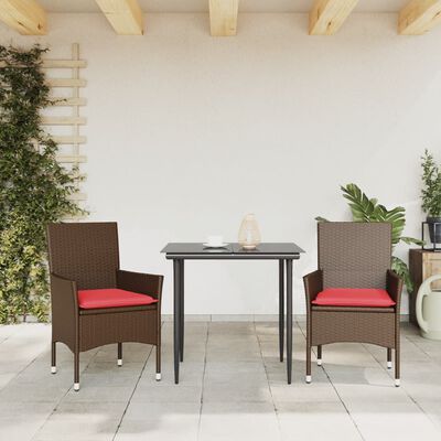 Brown wicker patio dining set with two chairs and a small table