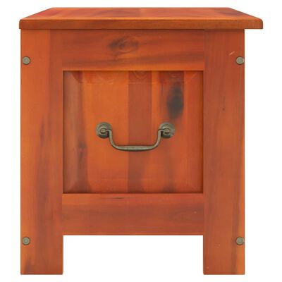 Close-up of the front drawer/door of the storage bench with metal handle.