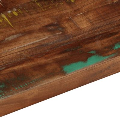 Close-up of the painted surface with teal paint chip and wood grain