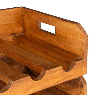 Close-up of wooden crate corner with handle cutouts and interior slots.