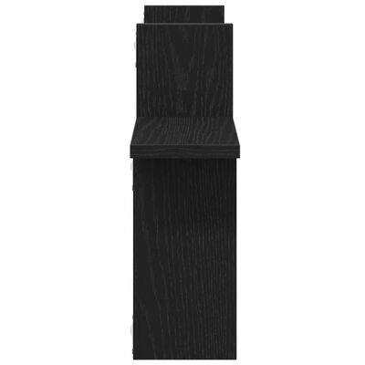 Top-down front view of a vertical black shelving piece showing a tall profile