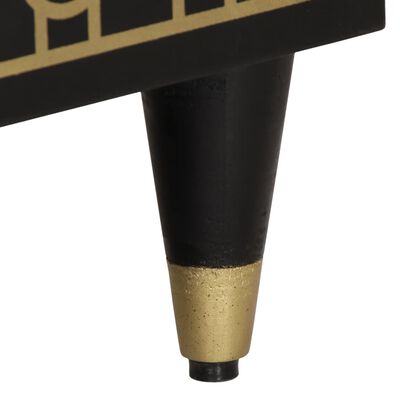 A furniture leg, black with a gold metal cap.
