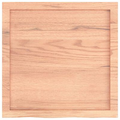 Close-up of a shallow wooden frame or recessed panel on a wooden surface