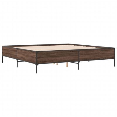 Long wooden platform bed frame with metal legs, single-masted supports, and no mattress.