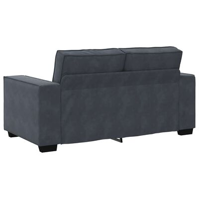 Back view of blue-gray sectional sofa showing cushions and base.