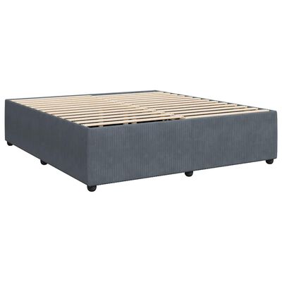 A blue fabric upholstered bed frame with wooden slats as a bed base, no mattress.