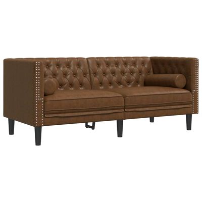 Side view of brown tufted sofa showing studded sides and angled legs.