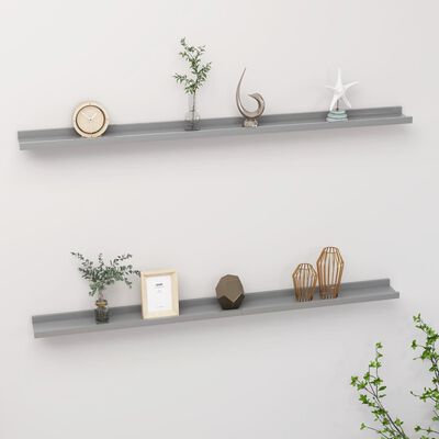 Two gray wall shelves with decorative items arranged