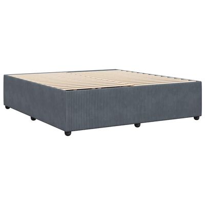 A wide shot of the blue upholstered bed frame from a distance, showing length and legs.