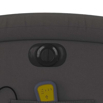 Close-up of control knob and yellow remote button on chair back panel.