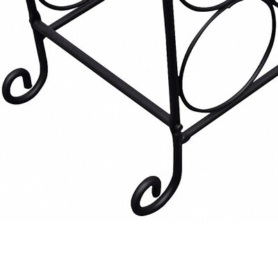 Close-up of black metal wine rack base