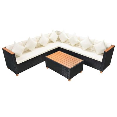 Black wicker sectional sofa set with beige cushions and a matching coffee table.