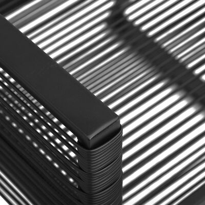 Close-up of chair corner with stacked rope-wrapped joint on black metal frame