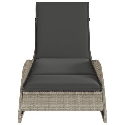 Front view of a single rattan chaise lounge with dark cushions.