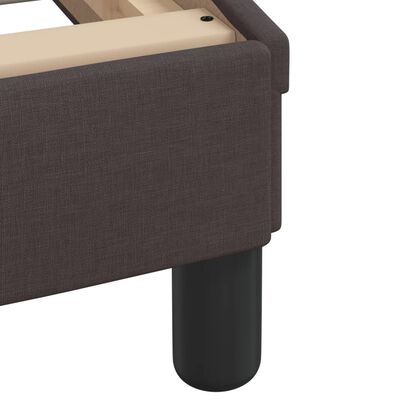 Close-up of black rounded bed leg support.