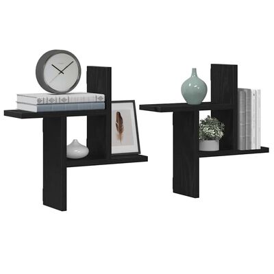 Pair of black wall shelves with decorative objects and books