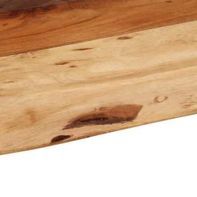 Close-up of wood grain and knots on a wooden plank.