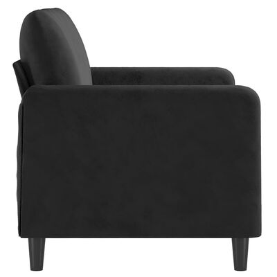Side view of a black upholstered armchair with rounded arms and tapered legs.