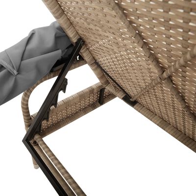 Close-up of the woven wicker frame and a gray fabric canopy secured to a metal frame; mechanism underneath.